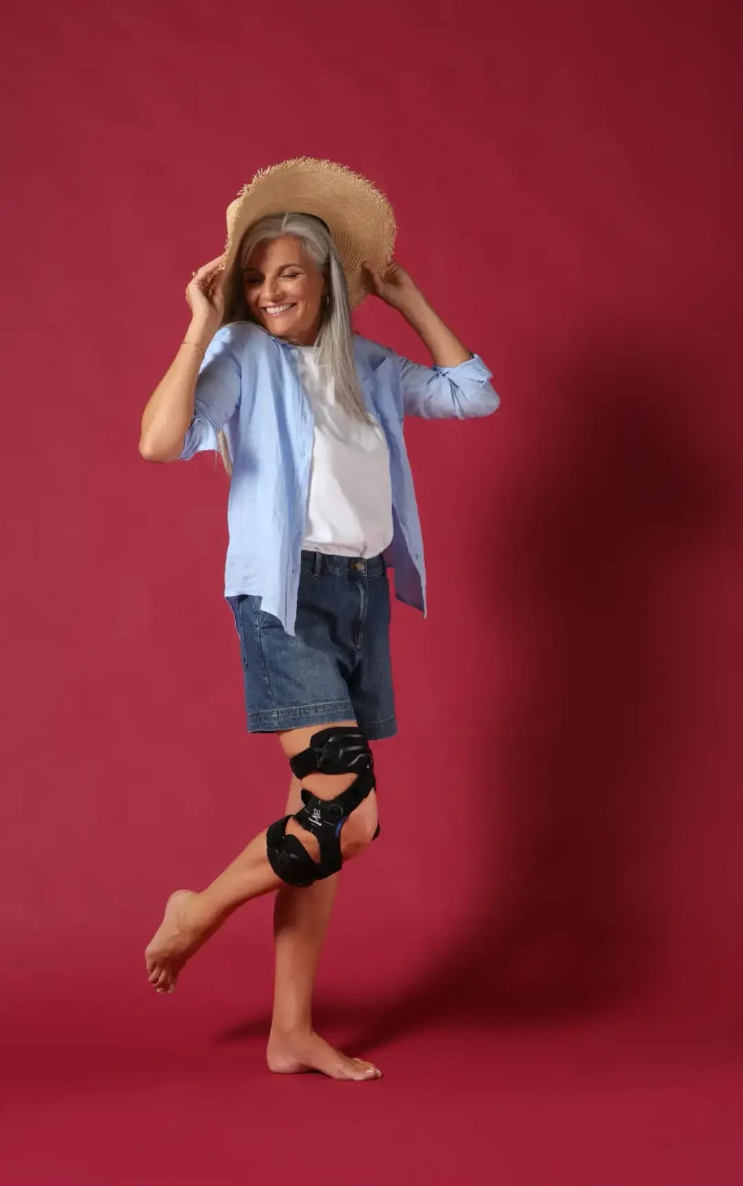 Adult wearing the UniReliever dynamic offloading knee brace